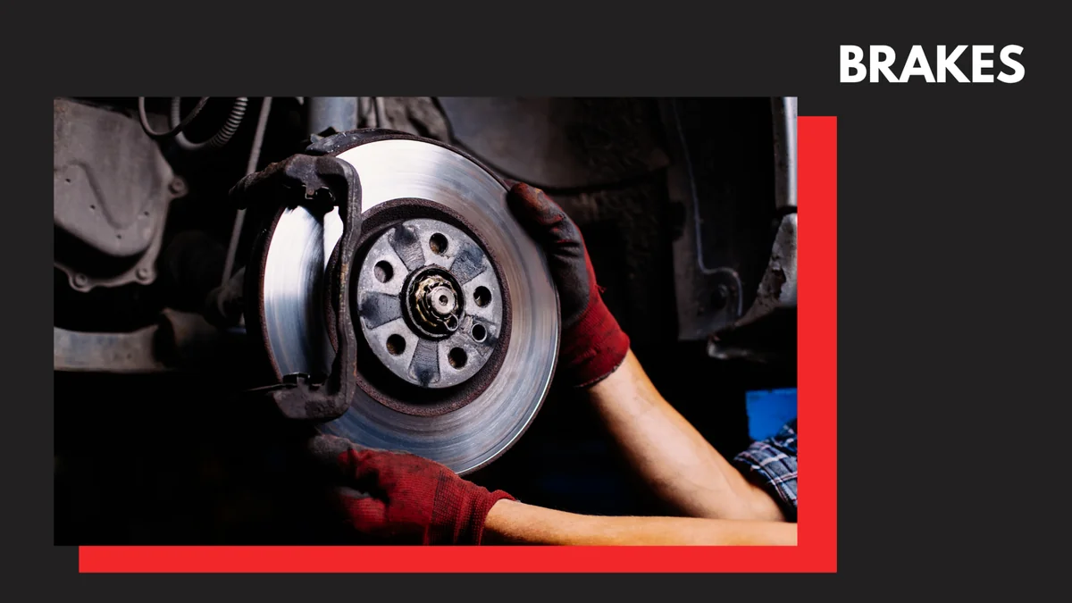 An automotive mechanic replacing the brake system.