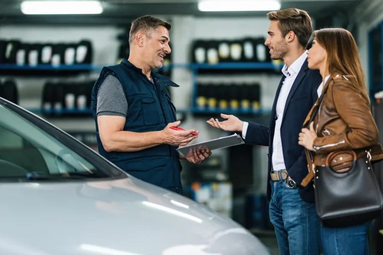 Service specialist discussing repair with customers